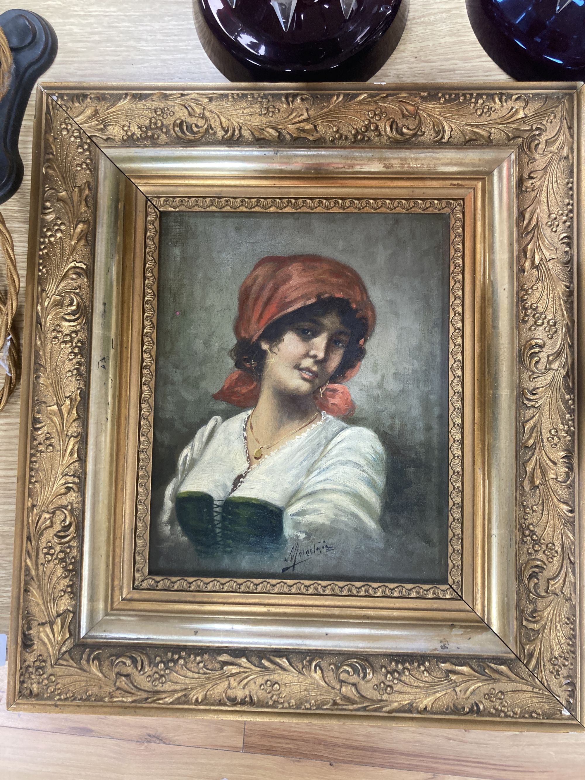 Italian School c.1900, oil on canvas, Portrait of a young woman, indistinctly signed, 25 x 20cm